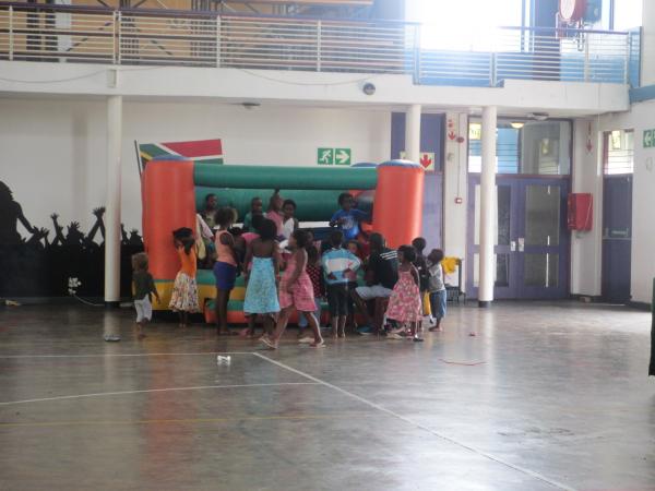 Children playing on the donated jumping castle. Photo by Mary-Jane Matsolo.