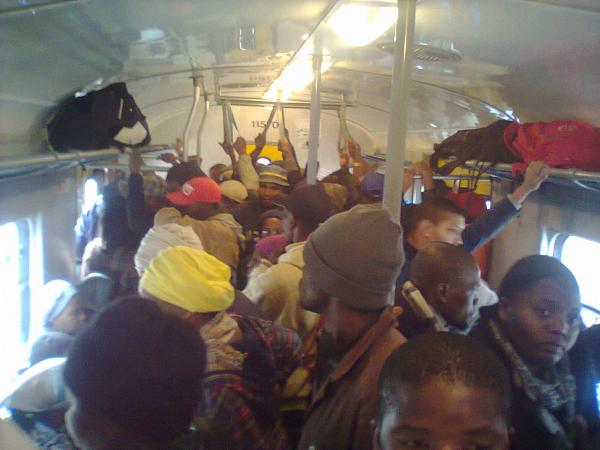 A packed train carriage. Photo by Neo Sithole