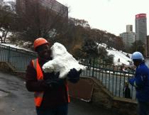 A security guard in Johannesburg shows off the snowdog he made. Photo by Alan Rheeder.