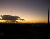 Khayelitsha at Dusk. A trip to Khayelitsha to check the status of the recently repaired streetlights showed that a large minority of the flood lights were also inactive. Photo by Gareth Dawson.