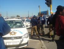 A police vehicle was stoned by protesting youths in Khayelithsa's BM section. Photo by GroundUp staff.