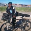 Mr Delekile uses his bicycle to reach his clients. Photo by Bonga Magazi. Mr Delekile uses his bicycle to reach his clients. Photo by Bonga Magazi.