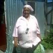 Maureen outside her home in Blikkiesdorp. Photo by Gabby Kelly. Maureen outside her home in Blikkiesdorp. Photo by Gabby Kelly.