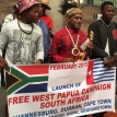 Equal Education members Richard Ubisi (left) and Niek Marutha (right) stand united with Benny Wenda of the Free West Papua Campaign. Photo by Joshua Maserow. Equal Education members Richard Ubisi (left) and Niek Marutha (right) stand united with Benny Wenda of the Free West Papua Campaign. Photo by Joshua Maserow.