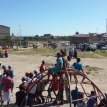 Manenberg residents and police watch as leaders of rival gangs in the area agree to a ceasefire. Photo by Waheed Sookool. Manenberg residents and police watch as leaders of rival gangs in the area agree to a ceasefire. Photo by Waheed Sookool.