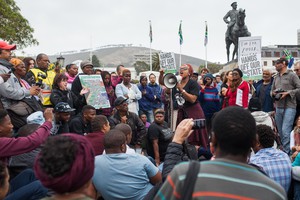 Phumeza Mlungwana, General Secretory of the Social Justice Coalition (SJC)  addresses the crowd outside Parliament during a Protest against president Jacob Zuma. The protest came after the firing of Finance Minister Pravin Gordhan and the reshuffling of the cabinet.
