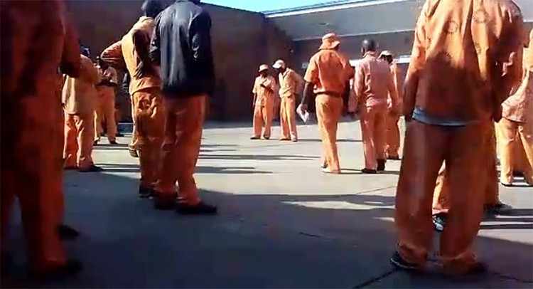 Photo of prisoners in a courtyard