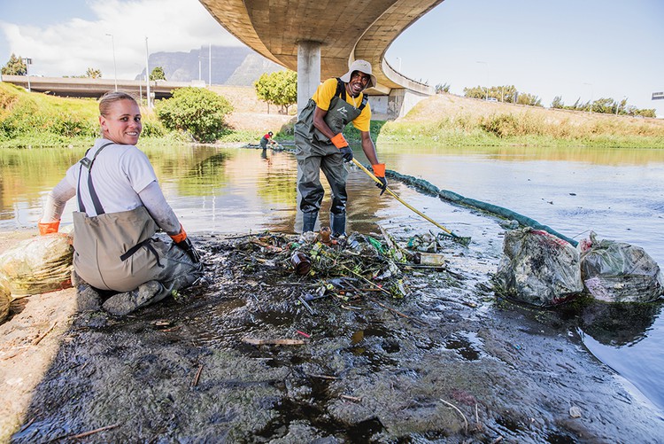 Photo of two people under a bridge