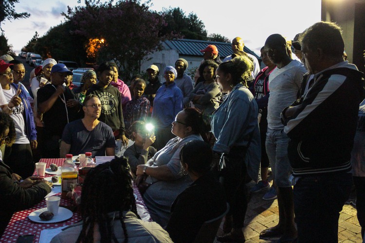 Photo of people at table at dawn