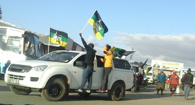 Photo of car with people campaigning for the ANC