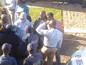 Photo of police and people talking