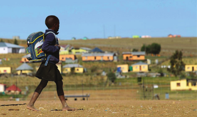 A photo of a girl walking to school