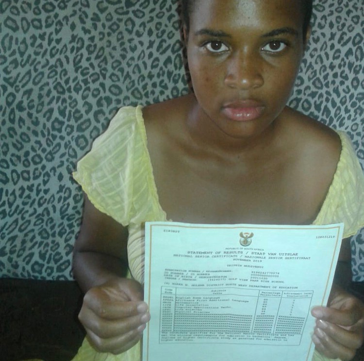 Photo of girl with matric certificate