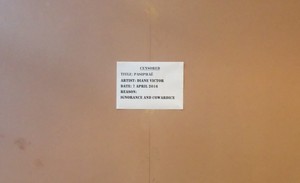 Photo of pamphlet on boarded up artwork