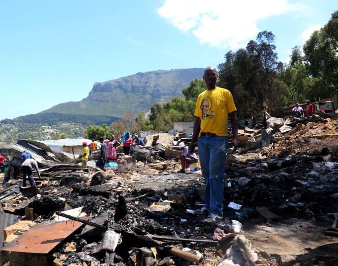 Photo of a man in Imizamo Yethu after the fire.