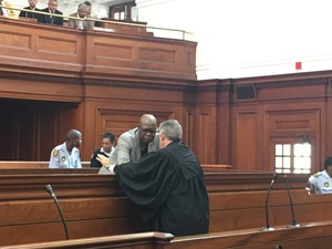 Photo of two men in a court room
