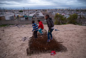 Photo of children playing on a hill just outside Blikkiesdorp, a temporary relocation area (TRA) found about 25km's from Cape Town’s city centre