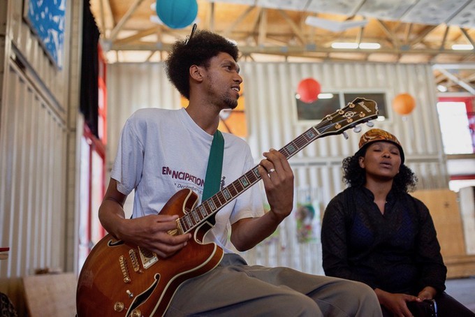 Photo of a man with a guitar