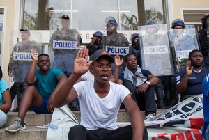 Photo of protesters and police