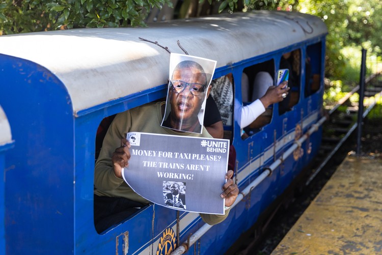 Commuters wore Fikile Mbalula’s photo on their faces.