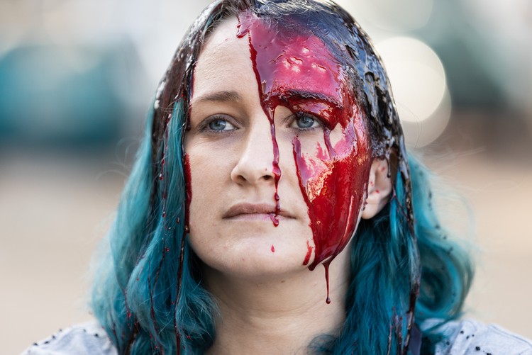 Members from Extinction Rebellion pour fake blood and oil over themselves in protest demanding an end to the exploration and exploitation of new gas fields in Africa. The protest happened outside the Cape Town International Convention Centre during Africa Oil Week. - Ashraf Hendricks