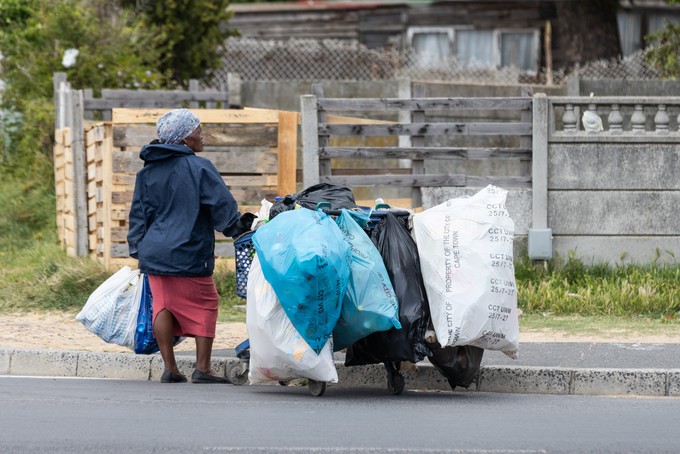 A woman collects recycling
