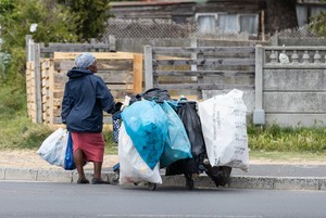 A woman collects recycling