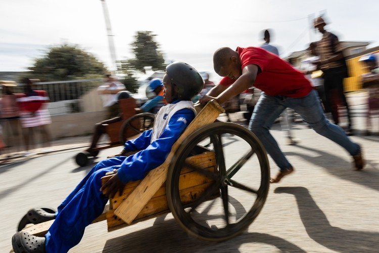 Children race go-karts in township