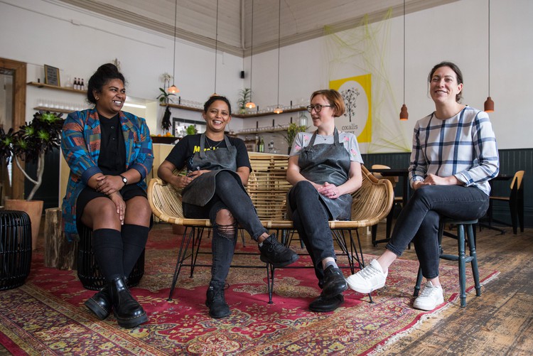 Photo of four women seated