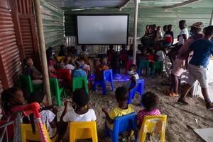Photo of children watching movie