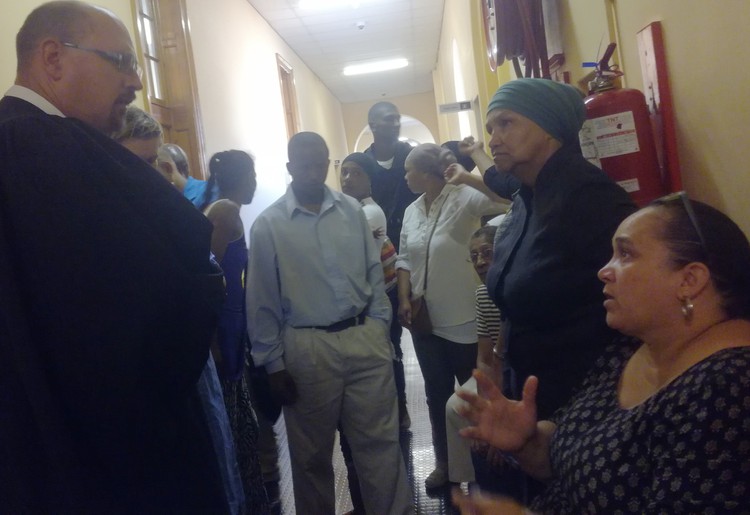 Photo of residents talking to lawyer