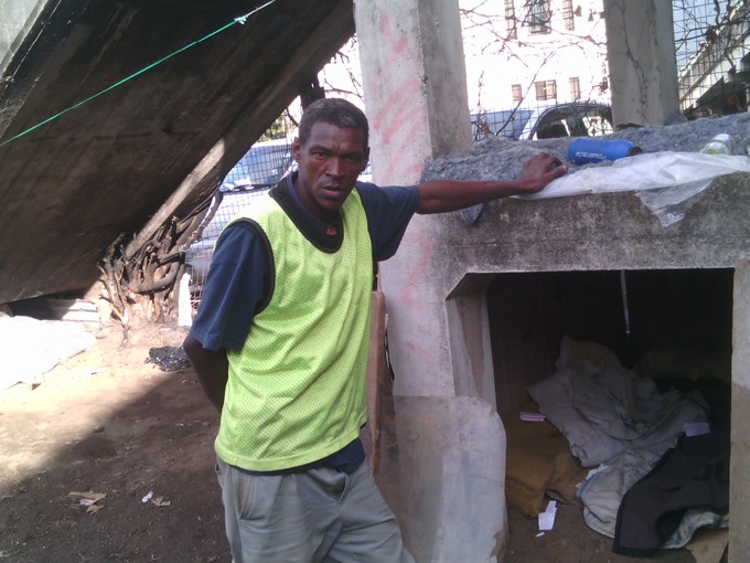 Photo of Antony Lewis in his shelter under a bridge.