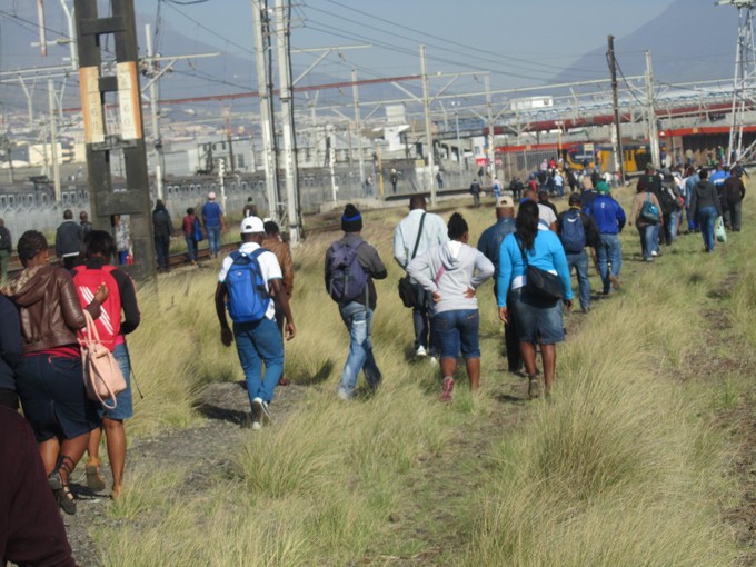 Photo of people walking in a field