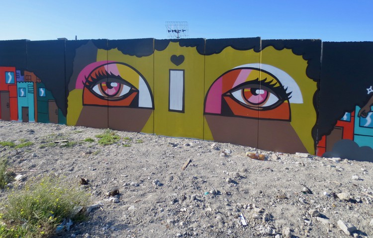 Photo of a mural of a head with eyes