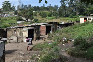 Photo of shacks on a hill