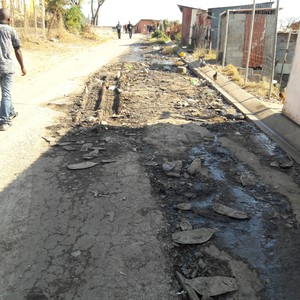 Photo of damaged road.