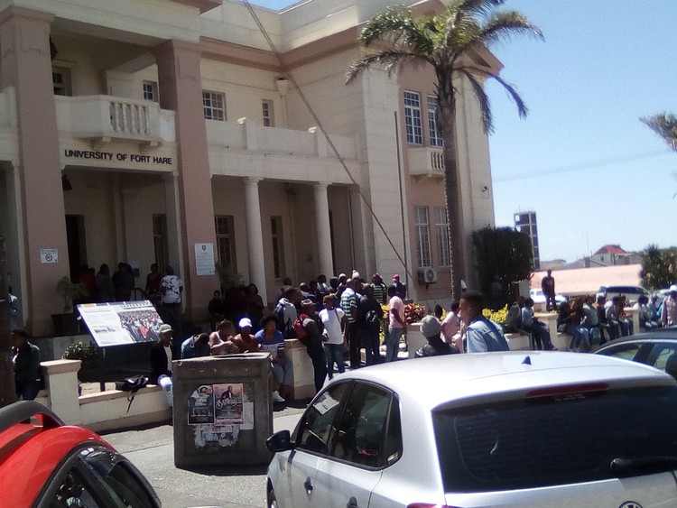 Photo of students outside building