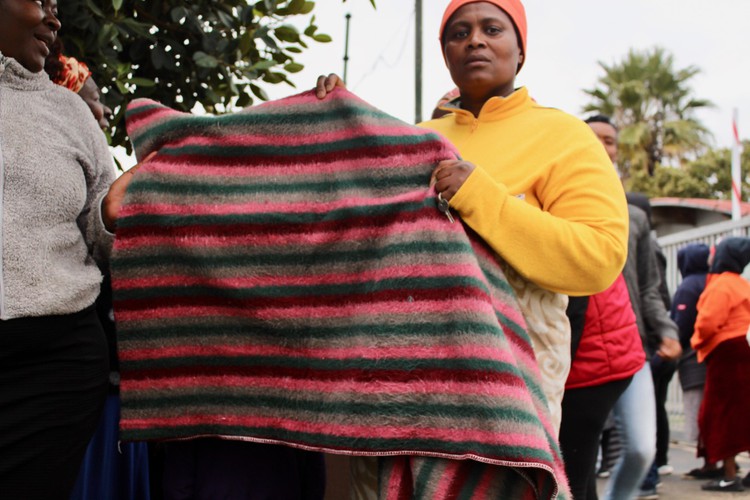 Photo of a woman with a blanket