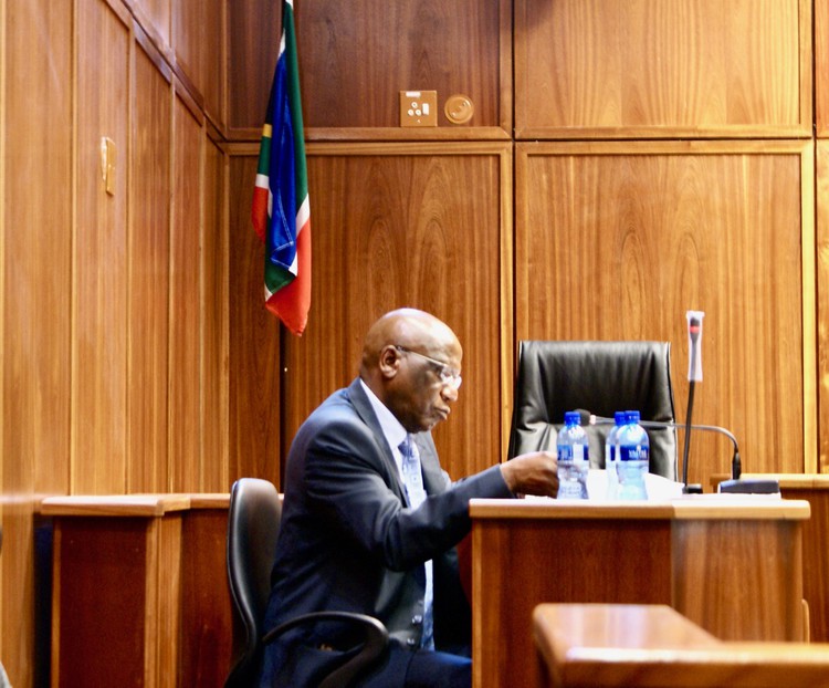 Photo of a man in courtroom
