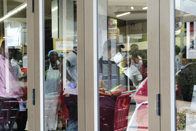 Photo of closed doors of a supermarket