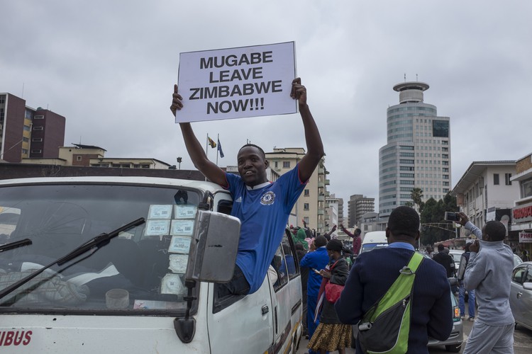In the city centre from early on Saturday morning protesters jumped on cars and hanged out of taxi windows waving placards calling for the removal of Mugabe.
