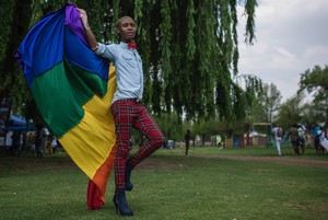 Photo of a man with the rainbow flag