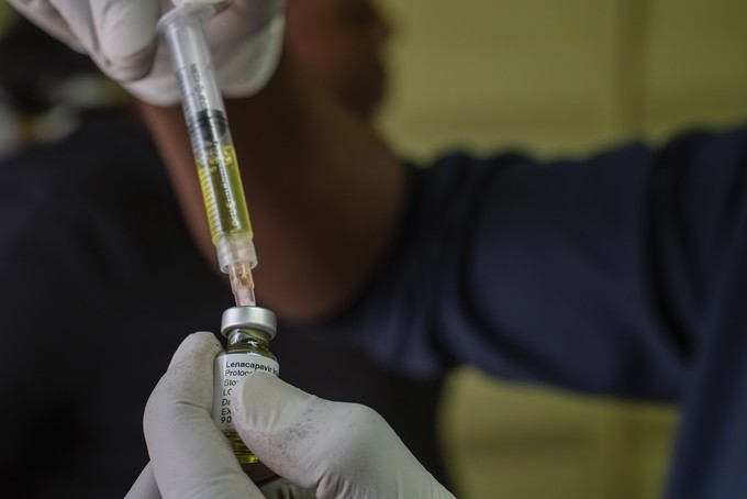 A nurse uses a syringe to draw Lenacapavir, an antiretroviral HIV prevention drug from a vial during a roll out of the drug as part of an implementation study by a Wits University research unit.