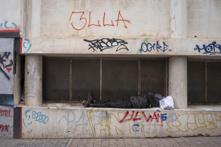 A homeless man is seen sleeping on the streets of the Johannesburg CBD.
