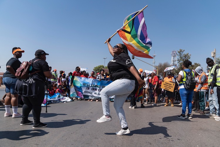 A participant waves the rainbow flag at the 18th edition of Soweto Pride.