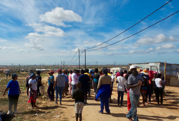 Photo of people in an informal settlement