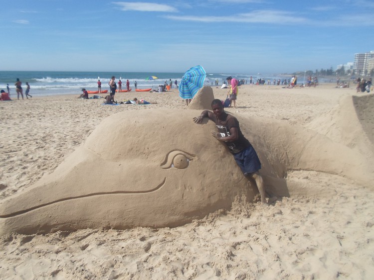 Photo of sand sculpture of dolphin