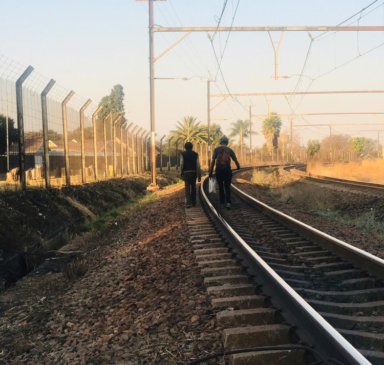 Photo of two men on a railway line
