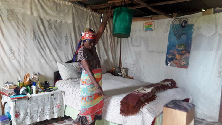 Photo of a woman in a shack