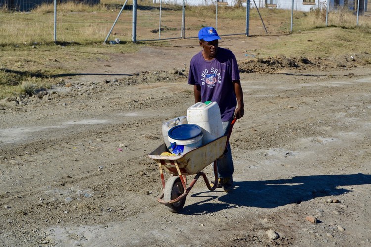 Photo of a man with a wheelbarrow